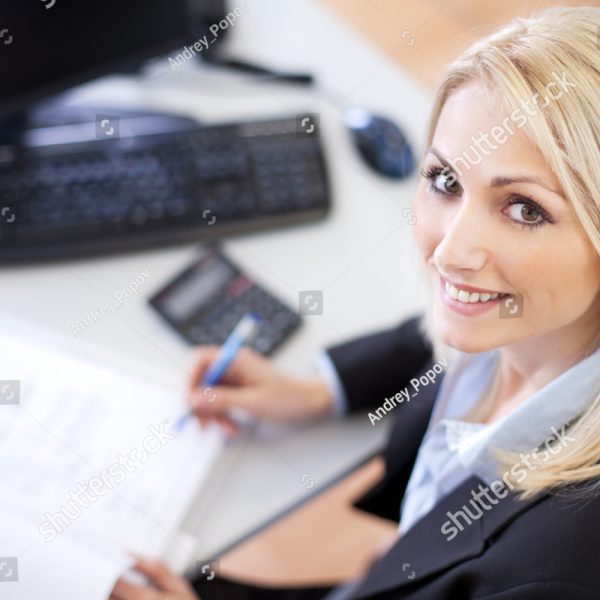 stock-photo-beautiful-businesswoman-doing-finances-in-the-office-93898261