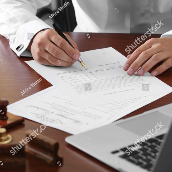 stock-photo-notary-public-in-office-signing-document-503322229